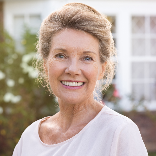 Happy customer holding PrimeBiome with visible skincare improvements
